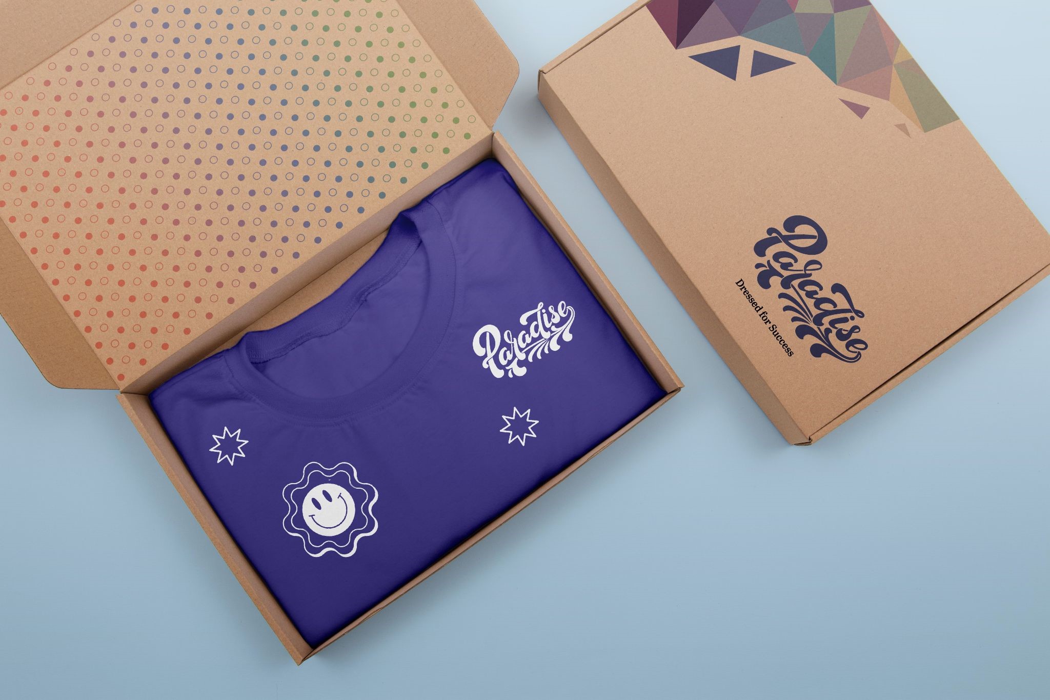 A custom recyclable corrugated mailer box featuring branded artwork and a t-shirt packed inside
