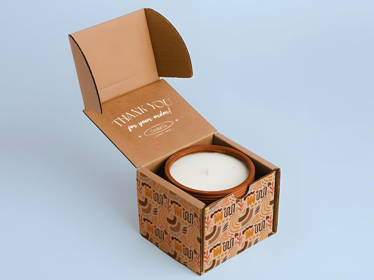 Custom printed corrugated mailer box packaging with candle product inside