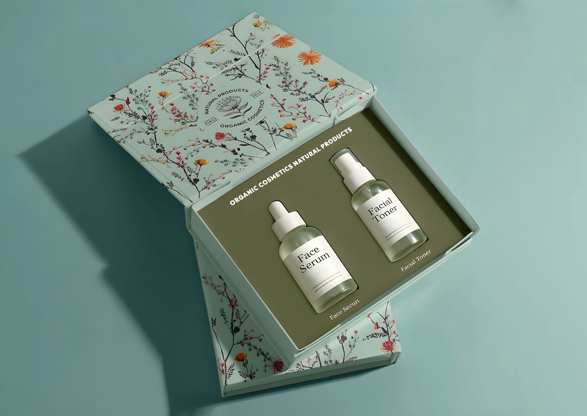 Cosmetic gift packaging box with botanical design, showcasing serum and toner inside a custom die-cut insert